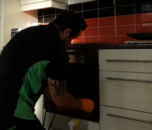 cleaning the kitchen oven